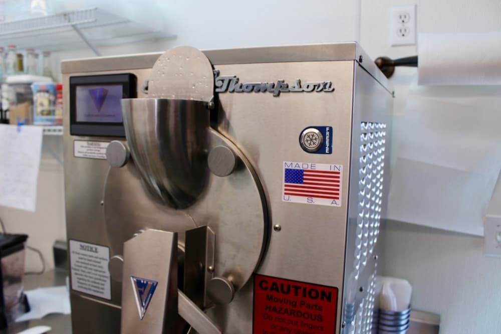 The ingredients are poured into the freezer. Gelato spins at 140 rotations per minute—compared to 230 rotations for ice cream—which contributes to its creamier texture. (Jishnu Nair/Community Impact Newspaper)