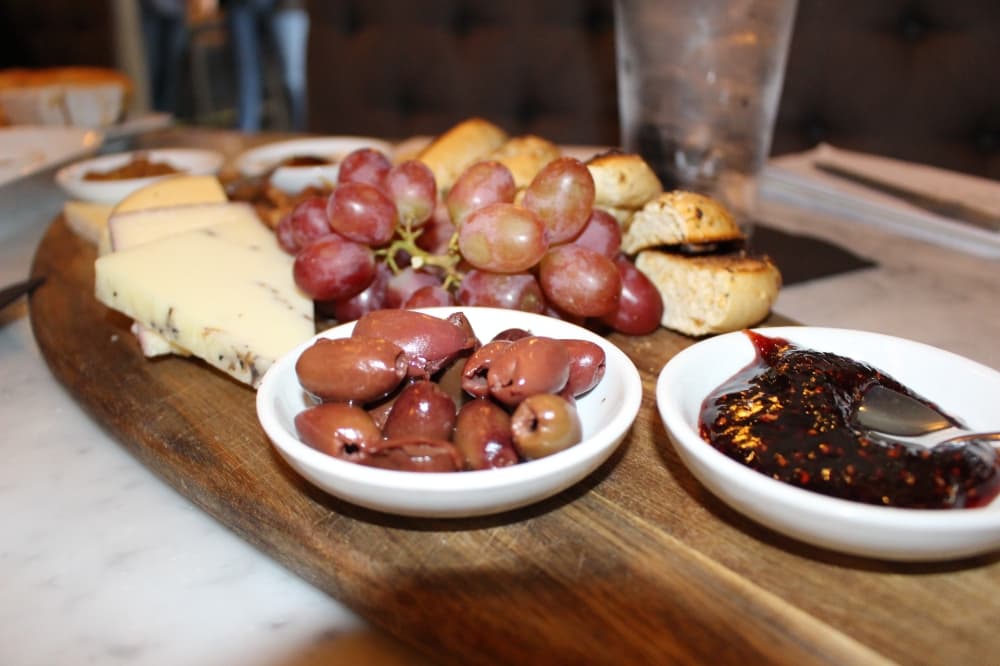 The J.Theodore Board ($25) is made up of bagels, cheese, olives, and fruit with various dipping sauces. (Miranda Jaimes/Community Impact Newspaper)