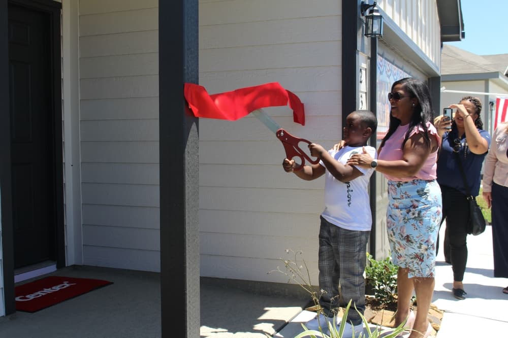 Army Spc. Kisha Dorsey saw her mortgage-free home for the first time May 26. (Kayli Thompson/Community Impact Newspaper)