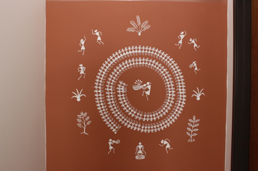 The art on Indian Kitchen's walls are by local artist Utttara Patil. They depict the Warli tribe, one of the largest in India. (Brooklynn Cooper/Community Impact Newspaper)