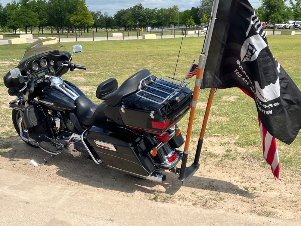 A Harley-Davidson with a POW/MIA flag and American Flag. (Joe Warner/Community Impact Newspaper)