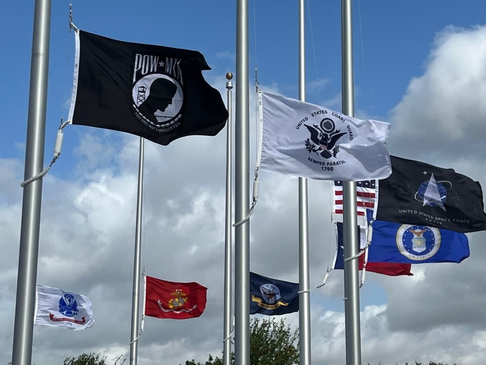 The flags at Yonders Point Plaza in Round Rock. (Joe Warner/Community Impact Newspaper)