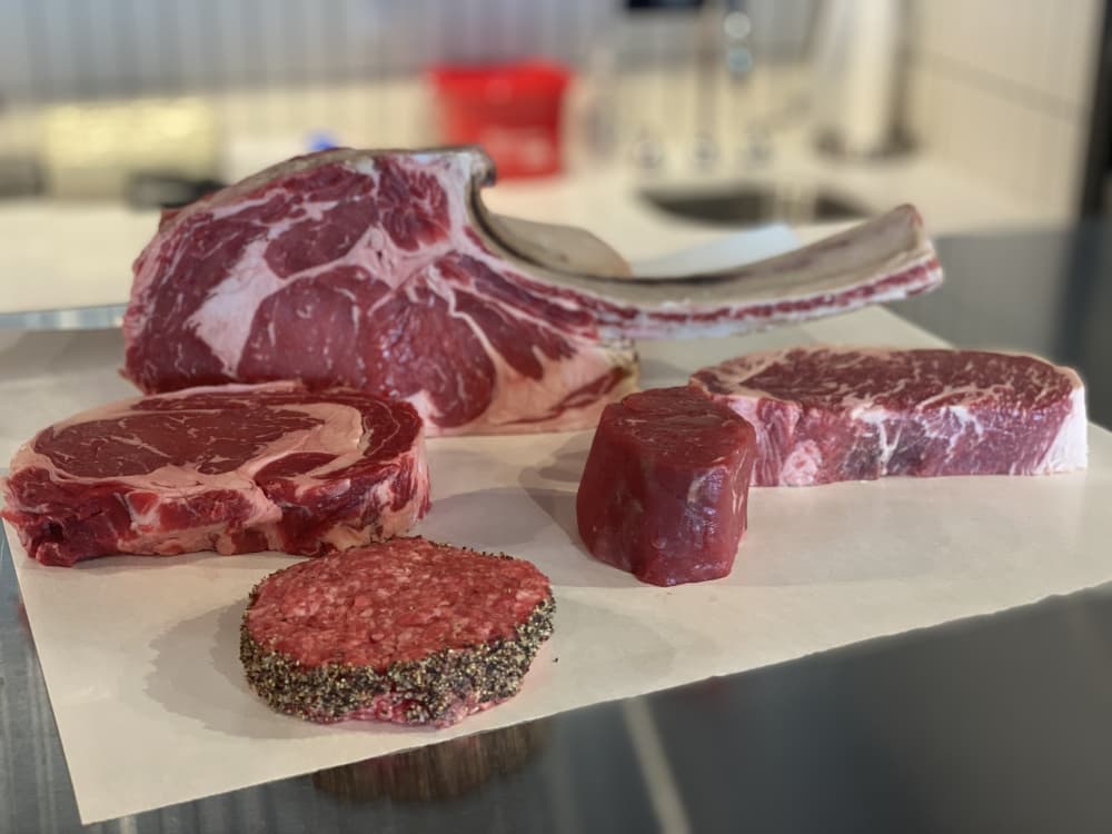 Beef cuts include Tomahawk steaks, ribeyes, strip steaks, filets, burgers and ground beef.