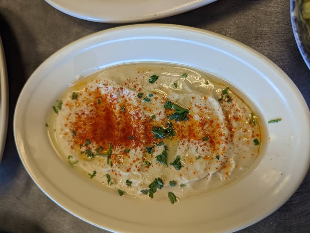 Hummus ($3.75): Chick pea dip is served with pita bread. (George Wiebe/Community Impact Newspaper)