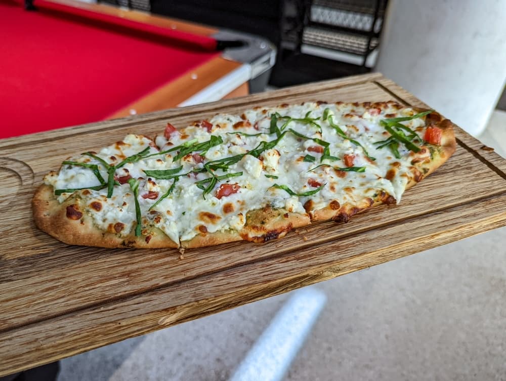 
The pesto flatbread ($11.99) is made with mozzarella and feta cheese, spinach and diced tomatoes on pesto sauce.