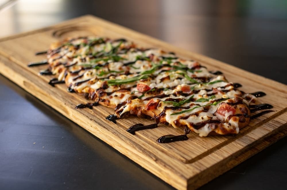 
The balsamic flatbread ($11.99) comprises Parmesan cream sauce, feta cheese, spinach and tomatoes topped with a balsamic wine reduction.
