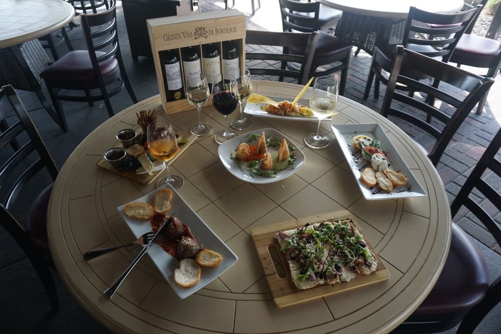 Happy hour at d'Vine Wine & Bistro includes six food choices and five wine options. (Mikah Boyd/Community Impact Newspaper)