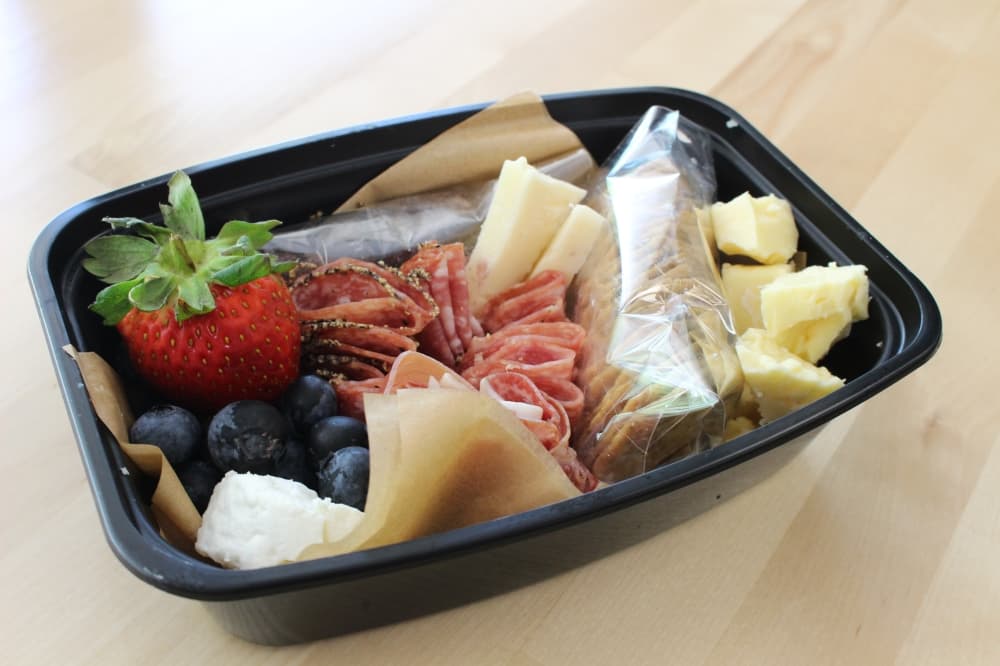 The adult lunchable ($11) has assorted cured meats and cheeses, gluten-free crackers and fresh fruit. (Andrew Christman/Community Impact Newspaper)