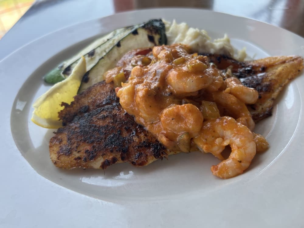 
The Catfish Pontchartrain offers blackened catfish served with garlic-smashed potatoes and grilled zucchini, topped with shrimp Cajun cream sauce. ($19.95)
Alternative: Catfish Pontchartrain ($19.95)