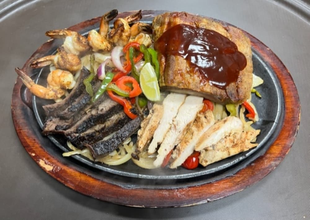 Deluxe Parrillada ($42.99) comes with barbecue pork ribs, gulf shrimp, and beef and chicken fajitas. (Courtesy Elizabeth Moreno)