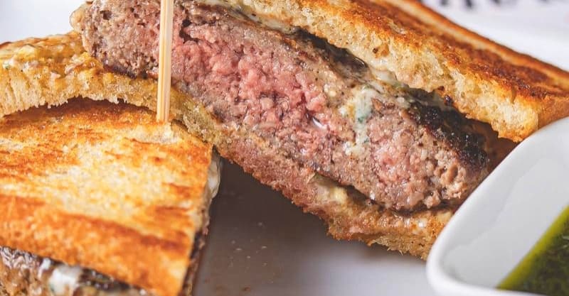 Sourdough sirloin burger ($12): A sirloin beef patty is served on sourdough toast with blue cheese crumbles. (Courtesy Mirage 38)