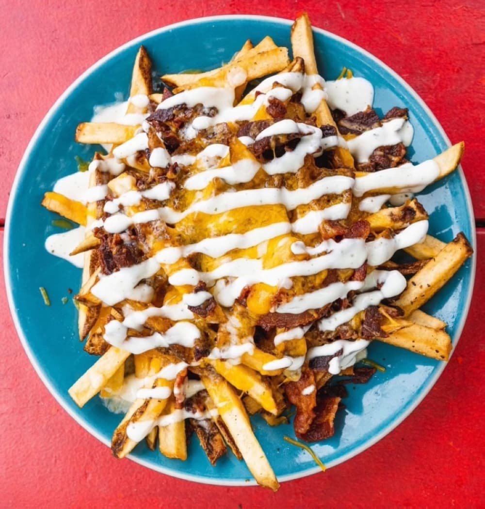 Rustic fries ($6.50): A plate of fries are served with crumbled bacon, cheese and a ranch drizzle. (Courtesy Lankford's)