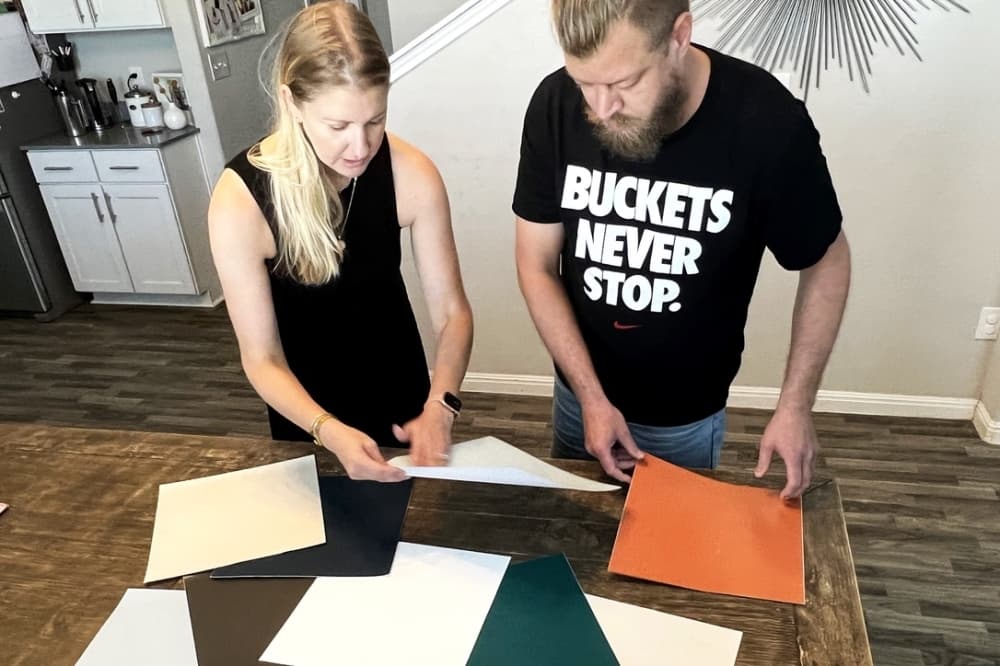 Laura Rugh, along with her husband, John, create peel-and-stick paint samples, which they sell to customers. (Zacharia Washington/Community Impact Newspaper)