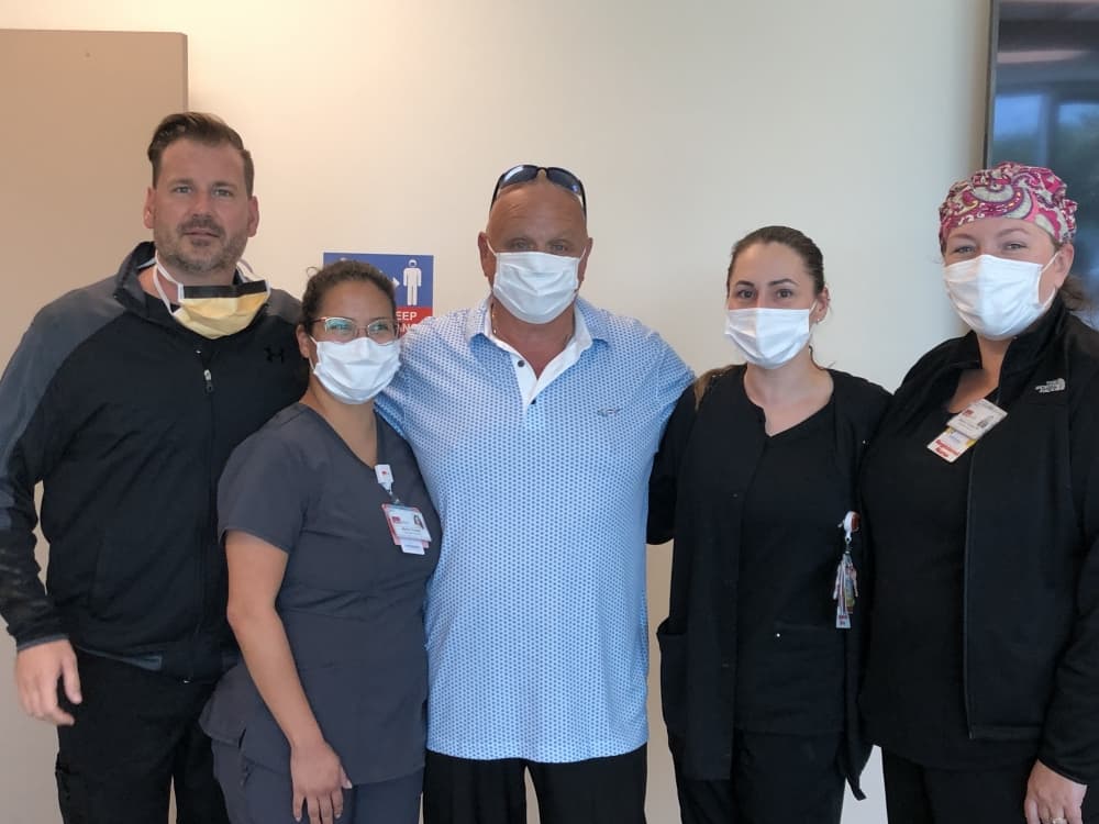 Langdon Cassidy surrounded by members of the catch lab team at the UTMB Health Clear Lake Hospital.