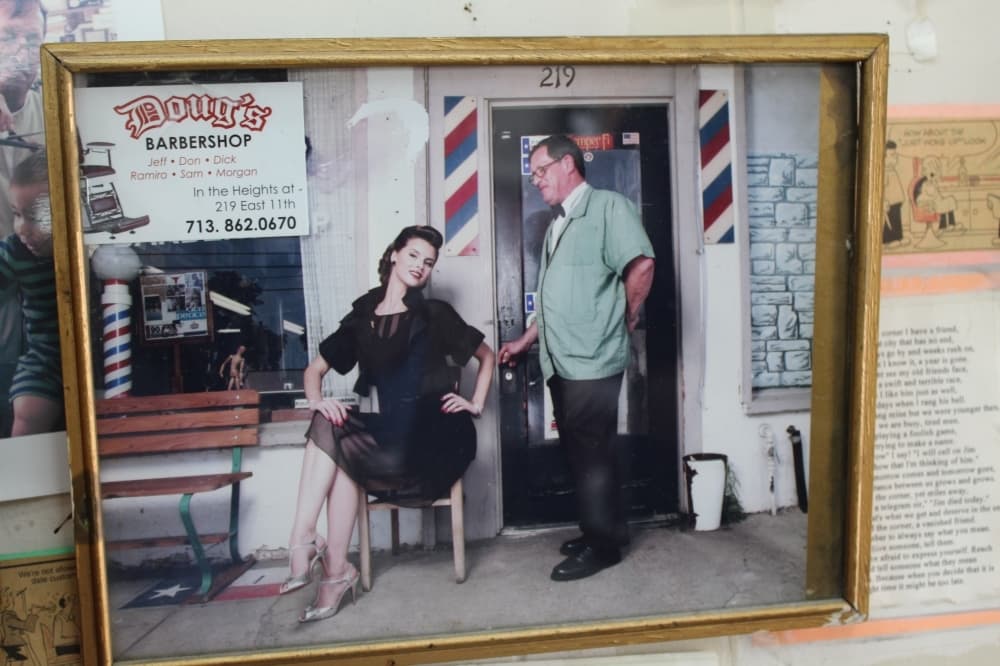 Doug Dreher (right) appeared in a photo series in Todo Texas magazine in 2007. This photo is one of many that hang on the walls of the shop. (Shawn Arrajj/Community Impact Newspaper)