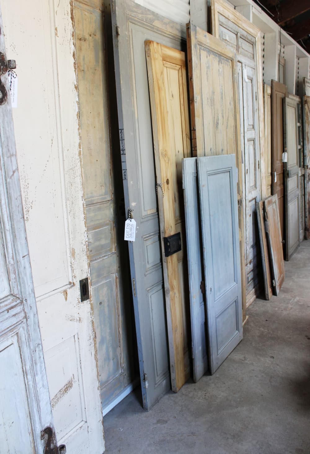 Most of the shop’s doors are European architectural salvage. They are functional antique doors that were pulled from demolished chateaux and manors. They are repurposed into modern homes to add character. $400-$4,000. (Karen Chaney/Community Impact Newspaper)