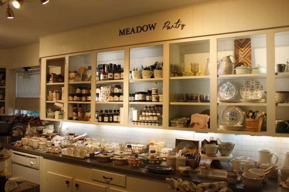The flower shop also offers items for sale, such as shirts, candles and jams. (Peyton MacKenzie/Community Impact Newspaper)