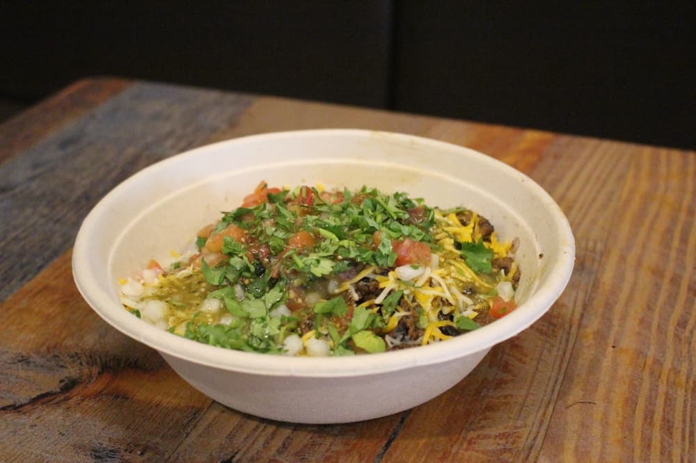 The burrito bowl ($10.50) can be built with any toppings as well as a choice of protein and rice. (Peyton MacKenzie/Community Impact Newspaper)