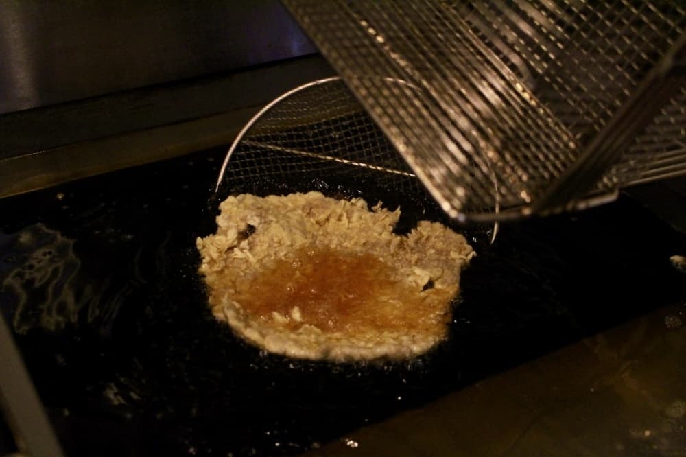 The steak is fried in oil for three minutes. Bahena-Cuevas said while Vaquero opens at 11 a.m. every day, it does not take long to prep entrees. (Jishnu Nair/Community Impact Newspaper)