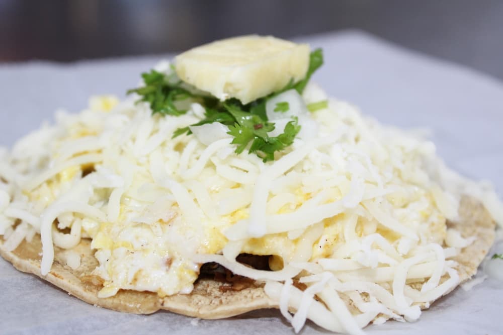 The taco Del Norte ($3.99) has a choice of pork carnitas, barbacoa or beef/carne asada served with egg, cheese, cilantro and onion.  (Karen Chaney/Community Impact Newspaper)