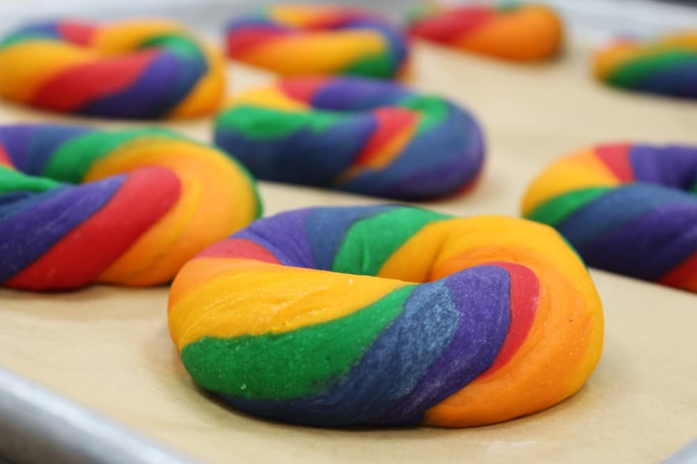 These individual rainbow bagels ($2.75 each) may be custom made with any color combination. (Karen Chaney/Community Impact Newspaper)
