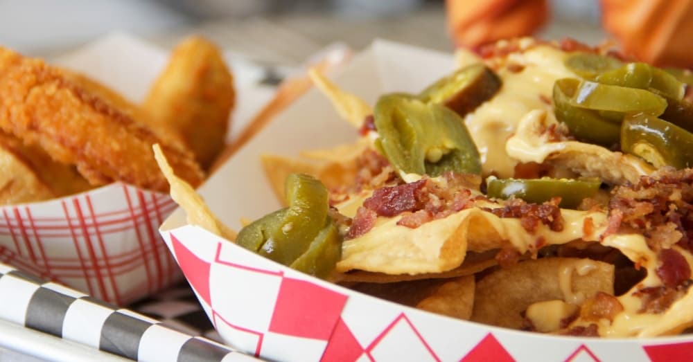 Goku’s Burger in Porter offers several appetizers in addition to burgers, including the Krillinachos ($7) and the Destructo Disc onion rings ($6). (Wesley Gardner/Community Impact Newspaper)