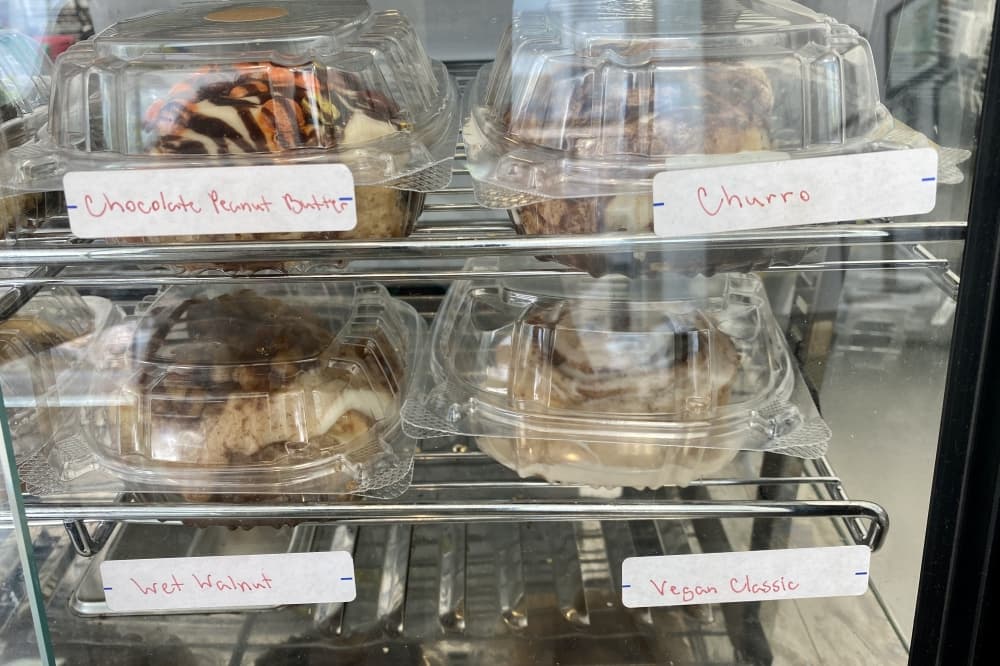 Four sweet rolls in boxes