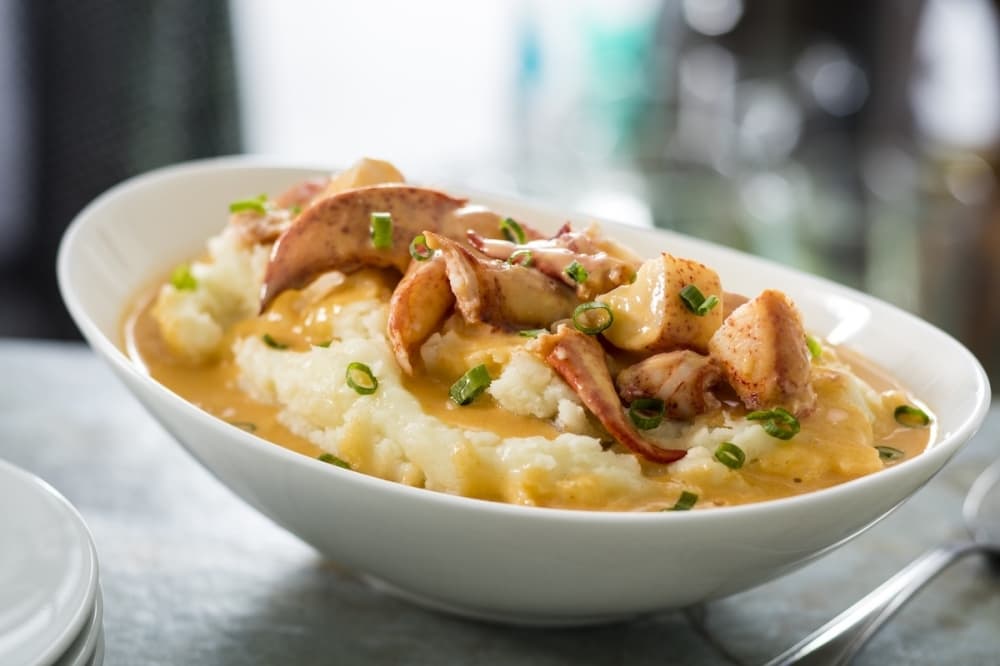 White cheddar mashed potatoes with butter-poached lobster.