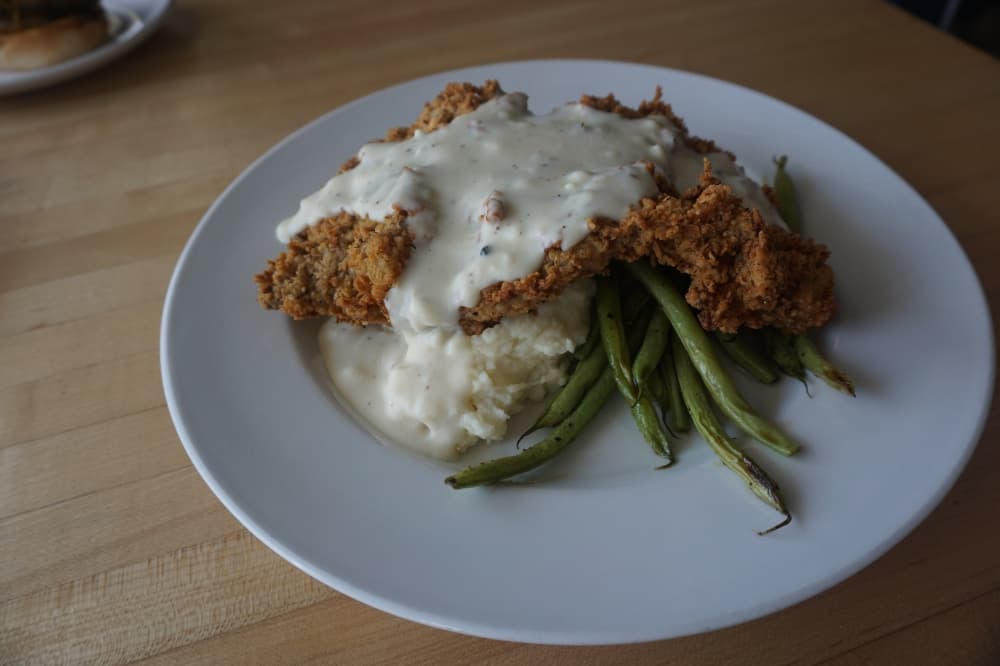 Chicken fried steak ($15)—The 44 Farms meat is served with green beans, mashed potatoes, black pepper and cream gravy. (Mikah Boyd/Community Impact Newspaper)