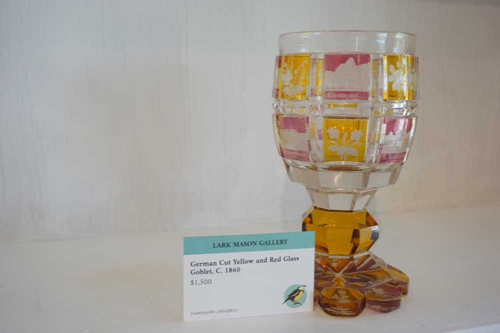 A Roemer Commemorative Goblet with yellow and red engraved glass from Mainz Germany from 1880 is on retail at the Lark Mason Gallery for $1,500. (Sierra Martin/Community Impact Newspaper)