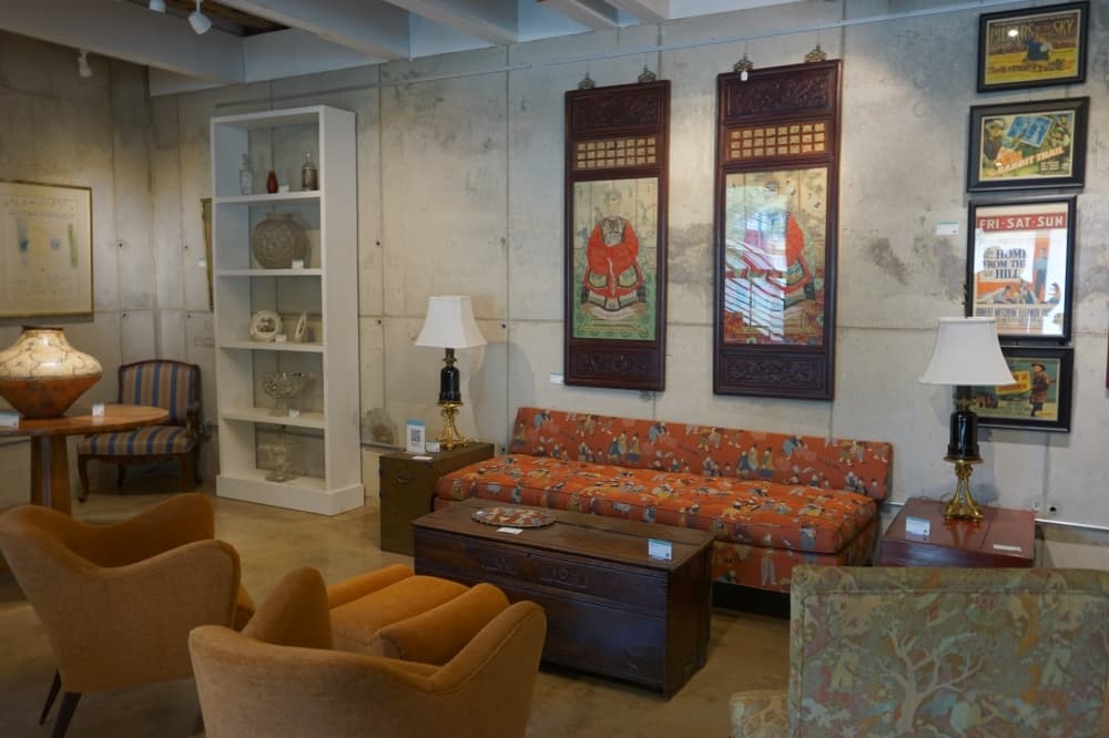 
The gallery floor features furniture and works of art available for sale.