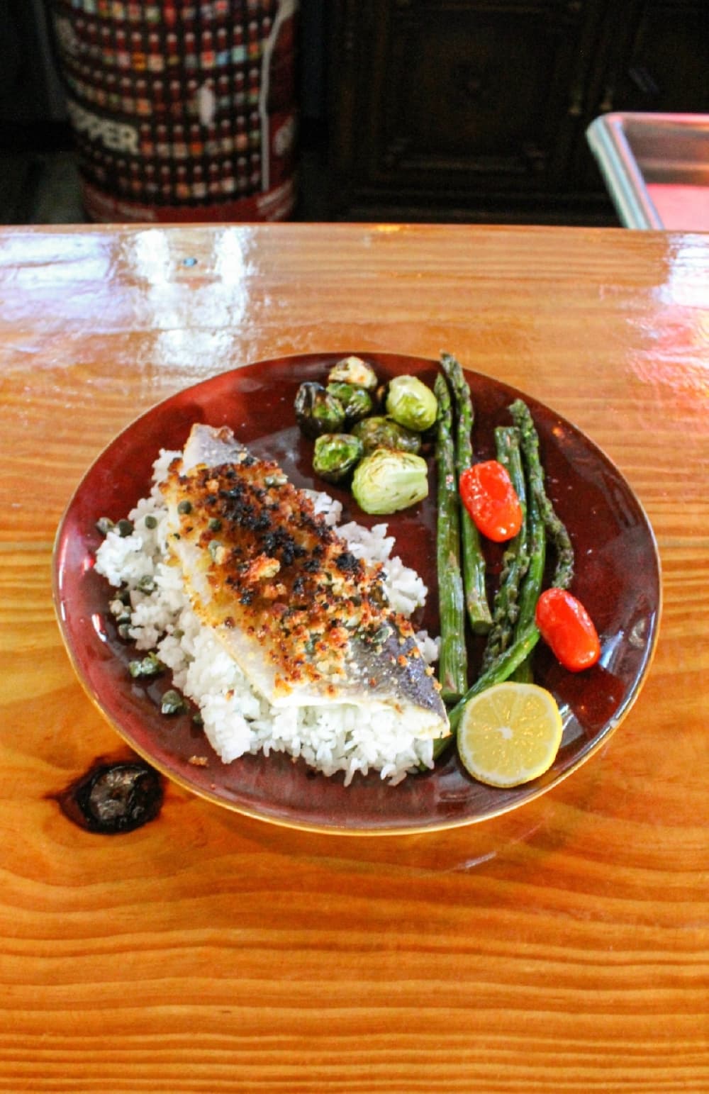 The broiled flounder ($17.50) comes on a bed of rice with roasted vegetables.