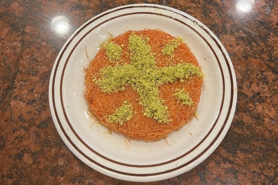 Kunafah ($7): a dessert made with pastry dough, three kinds of cheeses, syrup and pistachio (Zacharia Washington/Community Impact Newspaper) 