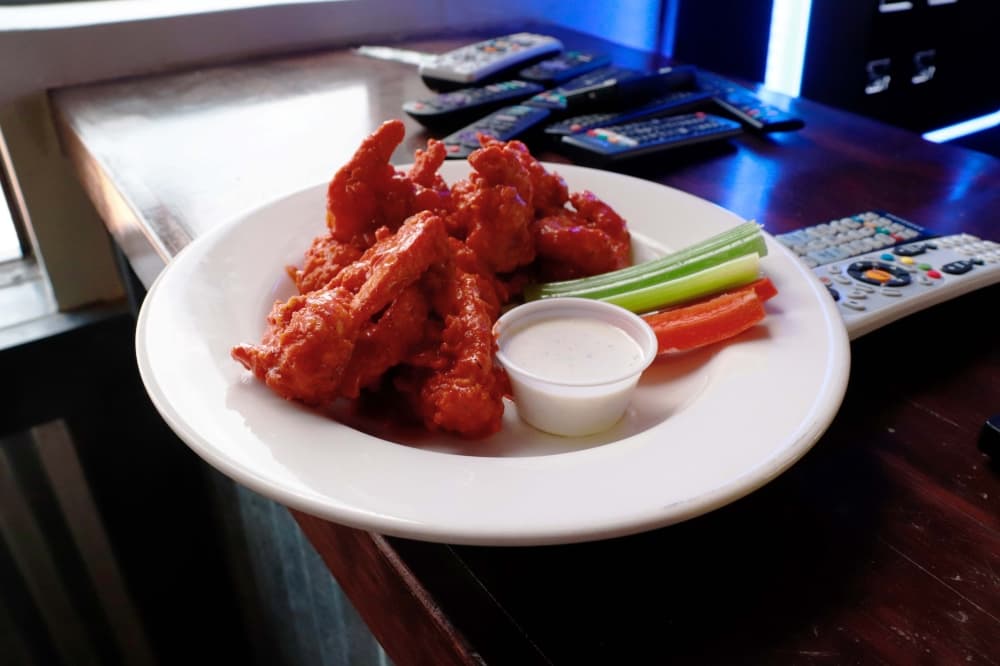 Customers can pick from 13 sauces—including mild, hot and BBQ—for their wings. ($10-$30) (Ilana Williams/Community Impact Newspaper)
