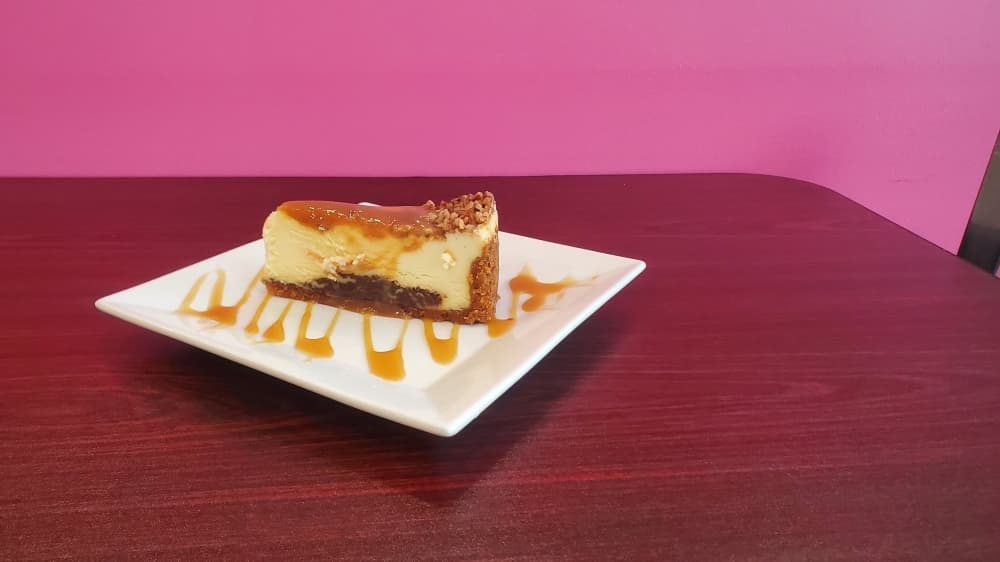 Turtle Cheesecake ($9.95) is made with chocolate, pecans, and graham cracker. (Photo by Cynthia Zelaya/Community Impact Newspaper)
