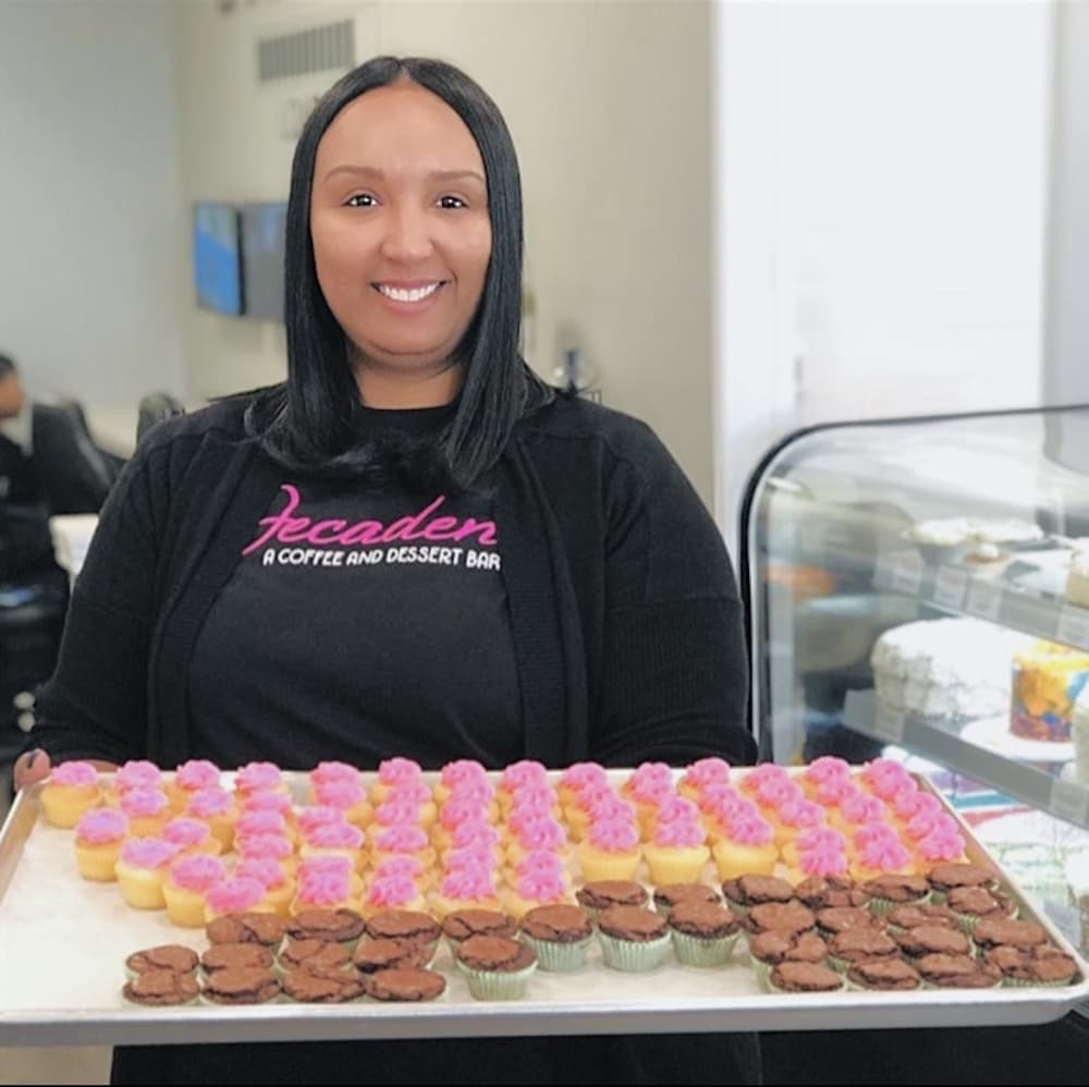 Owner Lamika Dickey poses with a batch of her cupcakes. (courtesy Lamika Dickey)