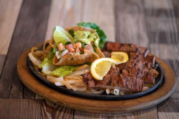 The beef fajitas ($16.99-$30.99) are served with housemade flour tortillas and sides. (Photos courtesy Belinda Sipp)