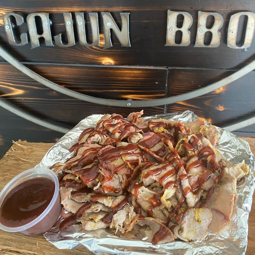 Kretzschy's menu features smoked shaved brisket, which is rubbed with the restaurant’s secret Cajun dry rub, then slowly smoked for 12-14 hours over hardwood oak. (Courtesy Kretzschy's Cajun BBQ)