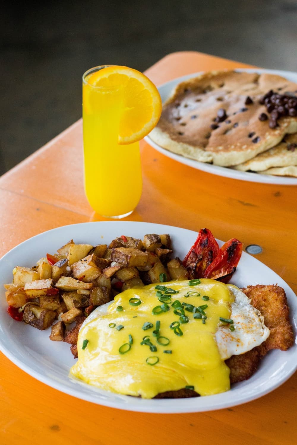 Bauern Schnitzel from Krause's Cafe is a pork schnitzel topped with two eggs and hollandaise sauce, a choice of home fries, hash browns, grits or black beans and biscuit. $12 (Krause's Cafe/Community Impact Newspaper)