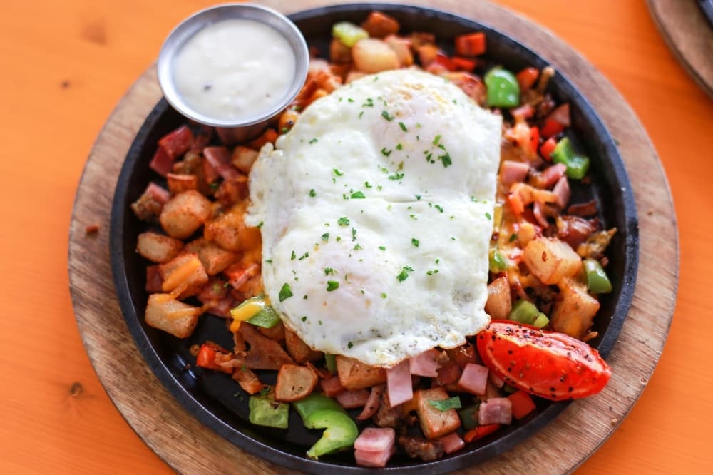 Corned Beef Hash from Krause's Cafe contains corned beef, onions, bell peppers, hash browns, two eggs and a  biscuit. $12 (Krause's Cafe/Community Impact Newspaper)