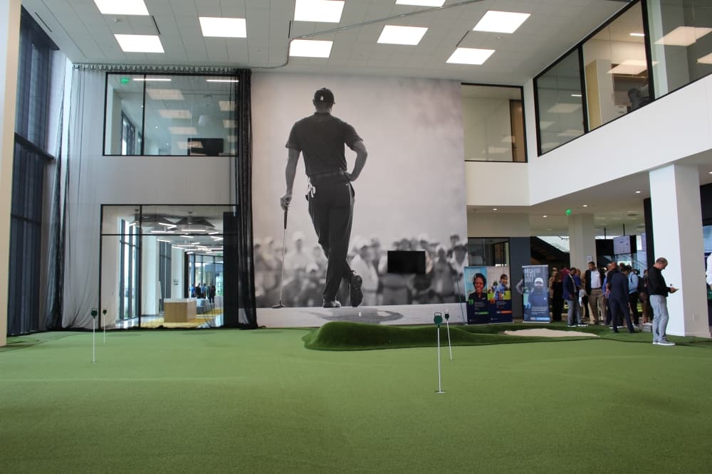 The new building includes a room with a large bunker for practice shots and a professional golf development center. (Colby Farr/Community Impact)