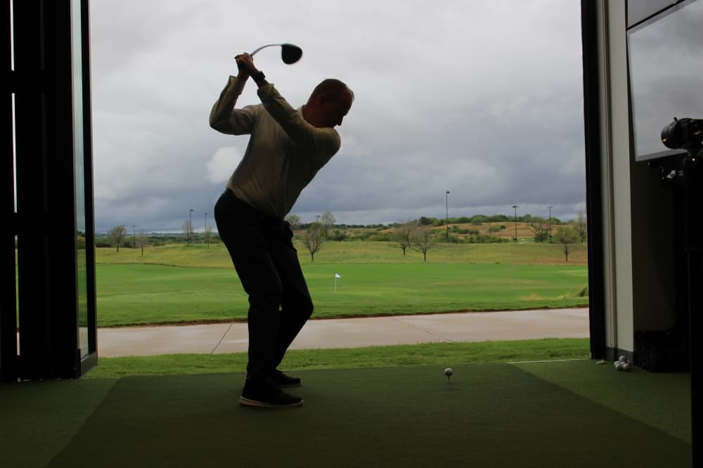 Frisco Mayor Jeff Cheney swings at a ceremonial first tee shot during PGA Frisco's "Welcome Home Celebration." (Colby Farr/Community Impact)
