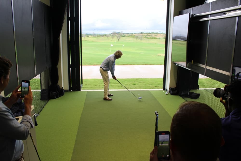 PGA CEO Seth Waugh lines up a ceremonial first tee shot during PGA Frisco's "Welcome Home Celebration." (Colby Farr/Community Impact)