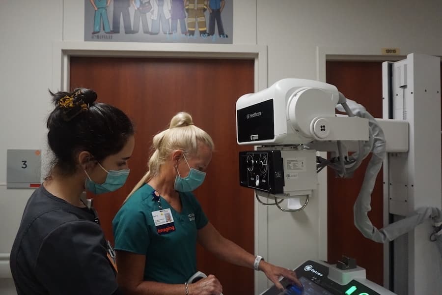 Nurses at HCA North Cypress review a patient's results on a mobile X-ray unit. (Mikah Boyd/Community Impact Newspaper)