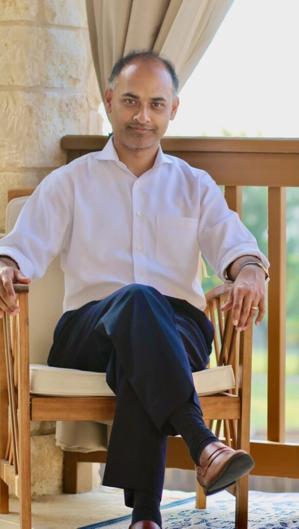 man posing in chair