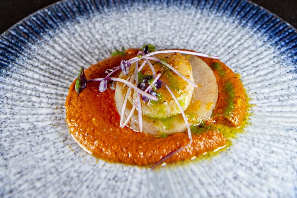 Seared Scallops ($20): Seared scallops are topped with romesco sauce, yukon gold potato and truffle oil. (Courtesy Plane & Level)