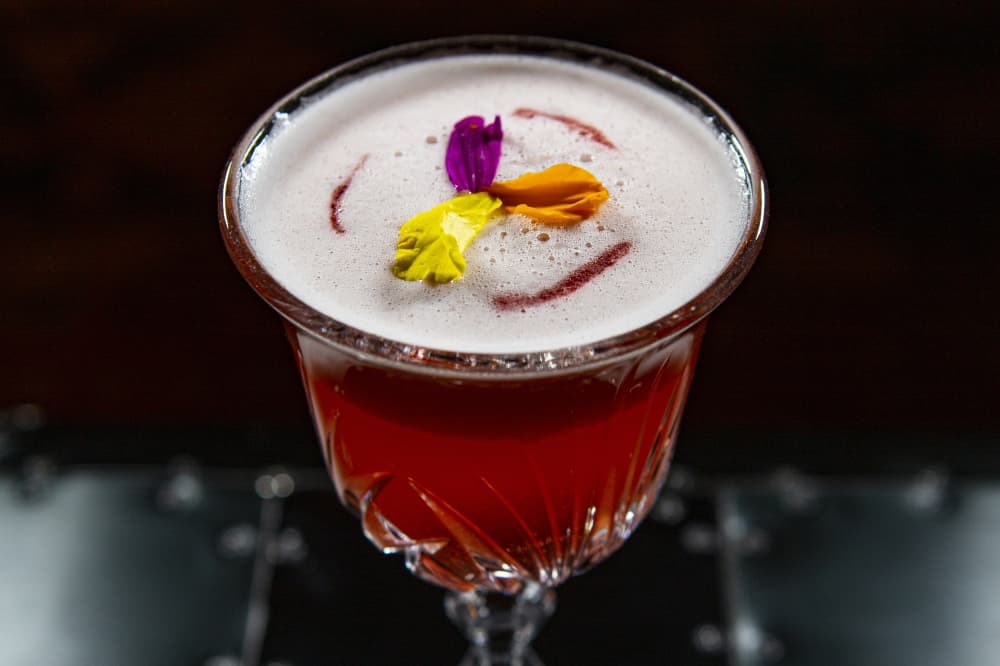 Plane & Level Martini ($16): This cocktail combines fortified champagne with pineapple juice, raspberry and maraschino cherry. (Courtesy Plane & Level)
