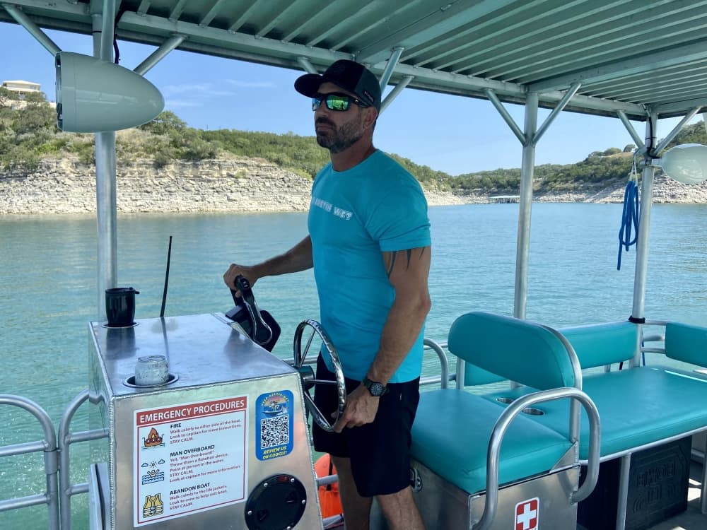 man driving boat
