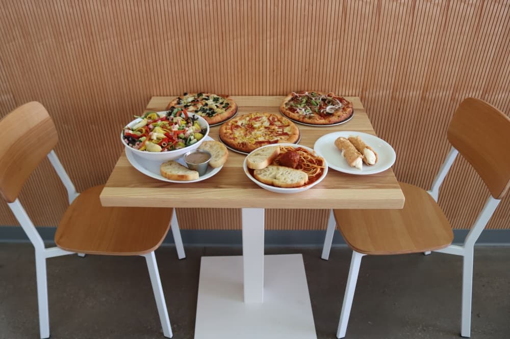 The Mici Handcrafted Italian menu features pizza, pasta, salad and desserts. (Grant Johnson/Community Impact Newspaper)