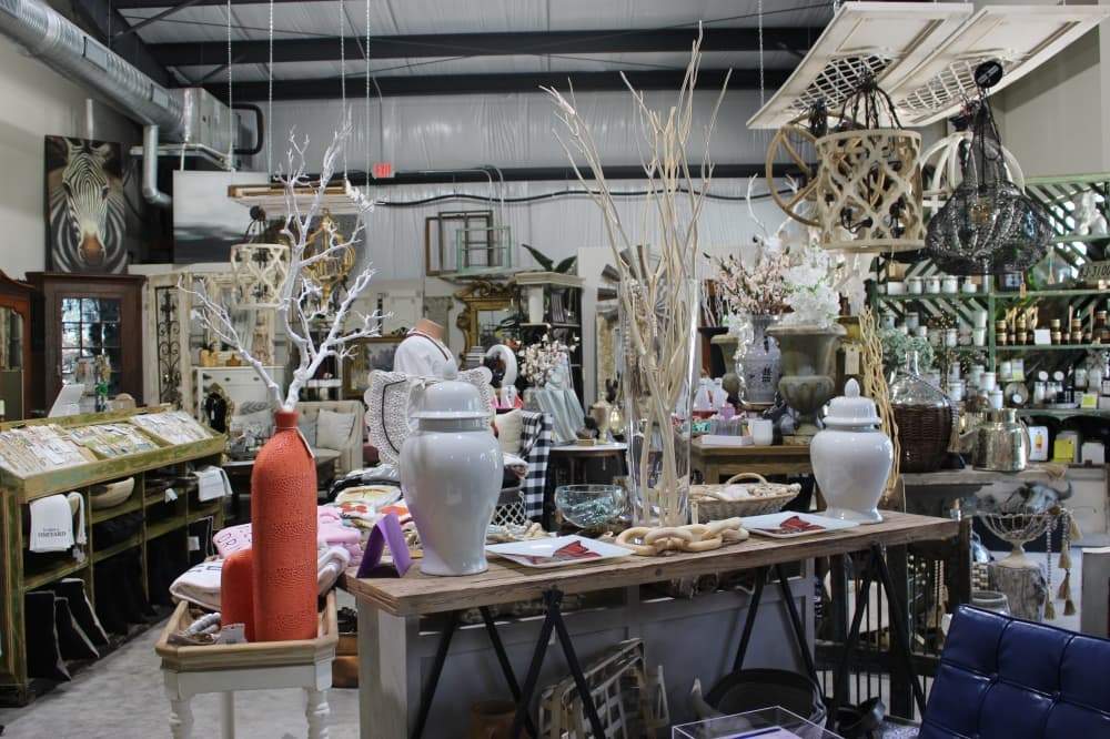 Some popular home decor items offered at Harper Row Home include jewelry, cards, side tables, candles, desks, vases, linens, mirrors, clothing and more. (Sara Rodia/Community Impact Newspaper)